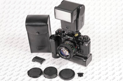 Aparat analogowy Canon A1 + obiektyw + lampa + Motor Drive + Battery Pack